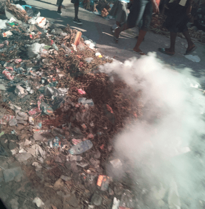 garbage burning in the streets of haiti
